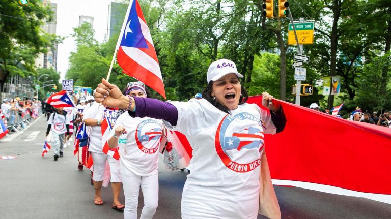 The health workers union 1199SEIU marches along Fifth Avenue at the 61st annual National Puerto Rican Day Parade.