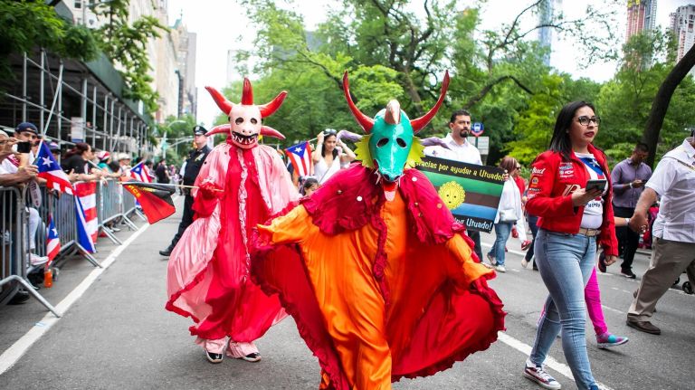 Traditional masks from Ponce, Puerto Rico, are worn at the 61st annual National Puerto Rican Day Parade.