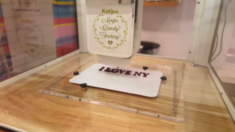 3-D printing candy machine debuts at Dylan's Candy Bar 15 There's no greater joy than watching a machine shoot gummy candy -- all-natural, vegan, gluten-free -- out of a machine, and having the finished product resemble your face (or whatever else you chose to print).