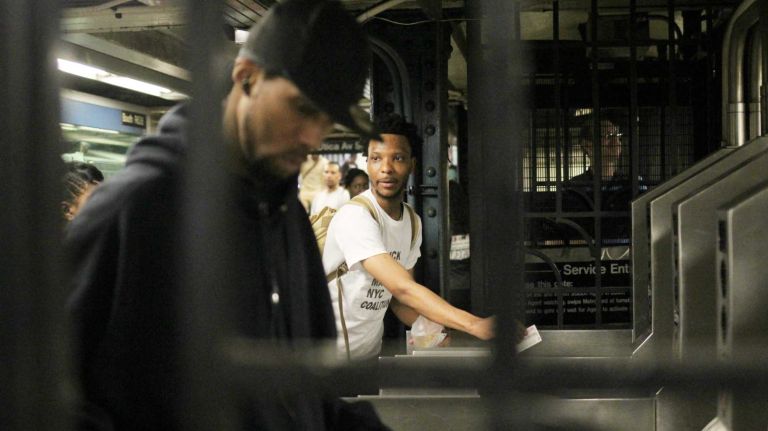 Free subway rides: See photos of protesters in Crown Heights 7 Devante Tate, of Afrikans Helping Afrikans, invites commuters to take advantage of a free MetroCard swipe at the Crown Heights-Utica Avenue subway station on Tuesday, June 7, 2016. Tate was one of about two dozen activists offering free subway rides as part of