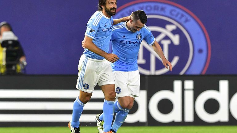 NYCFC vs. Real Salt Lake 29 New York City FC midfielder Jack Harrison (11) is congratulated by midfielder Andrea Pirlo (21) after scoring his second half goal in an MLS game against Real Salt Lake at Yankee Stadium in Bronx, New York on Thursday, June 2, 2016.