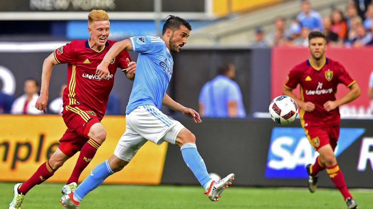 NYCFC vs. Real Salt Lake 39 New York City FC forward David Villa (7) attempts a shot on goal while pursued by Real Salt Lake defender Justen Glad (15) in an MLS game at Yankee Stadium in Bronx, New York on Thursday, Jun 2, 2016.