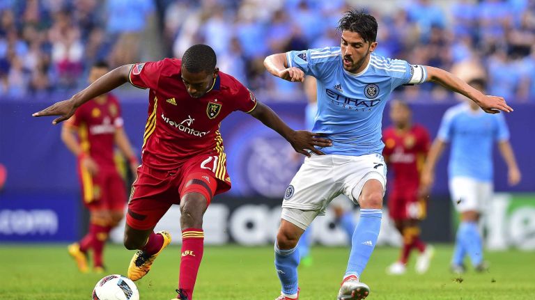 NYCFC vs. Real Salt Lake 47 Real Salt Lake defender Aaron Maund (21) is pursued by New York City FC forward David Villa (7) in an MLS game at Yankee Stadium in Bronx, New York on Thursday, Jun 2, 2016.