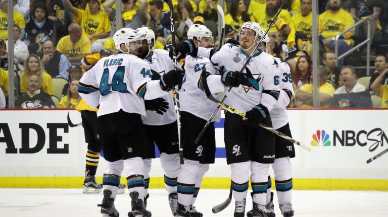 Justin Braun #61 of the San Jose Sharks celebrates with teammates after scoring a third period goal against Matt Murray #30 of the Pittsburgh Penguins (not pictured) in Game Two of the 2016 NHL Stanley Cup Final at Consol Energy Center on June 1, 2016 in Pittsburgh, Pennsylvania.