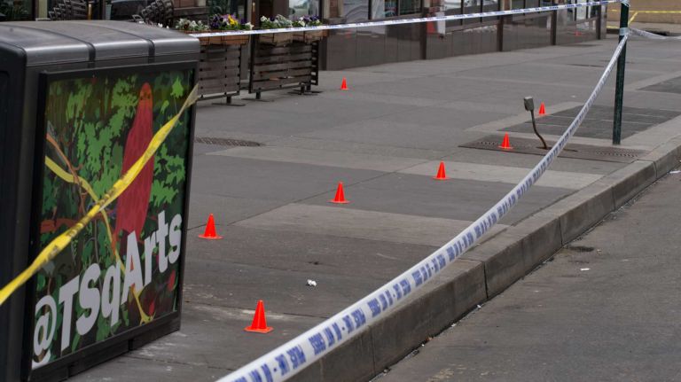 NYPD officers were on the scene of a cop-involved shooting on May 18, 2016. Police said that a knife-wielding man was fatally wounded by police after a confrontation outside of a midtown Food Emporium.