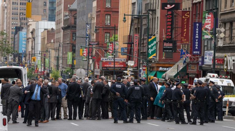 NYPD officers were on the scene of a cop-involved shooting on May 18, 2016. Police said that a knife-wielding man was fatally wounded by police after a confrontation outside of a midtown Food Emporium.