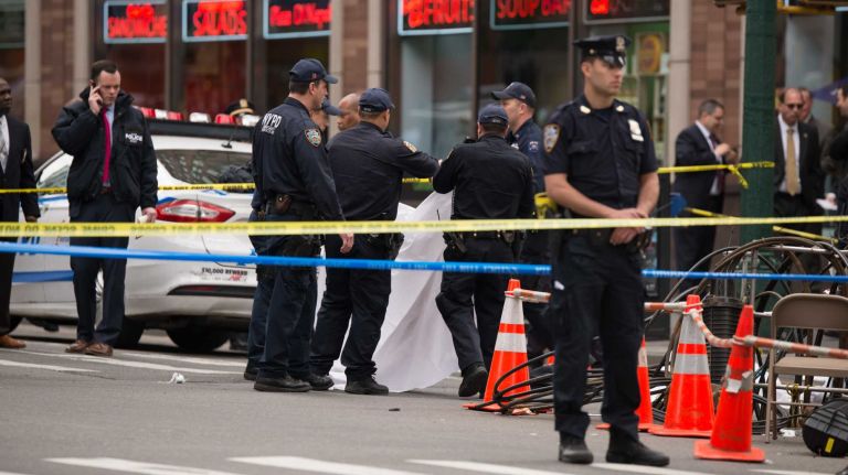 NYPD officers were on the scene of a cop-involved shooting on May 18, 2016. Police said that a knife-wielding man was fatally wounded by police after a confrontation outside of a midtown Food Emporium.