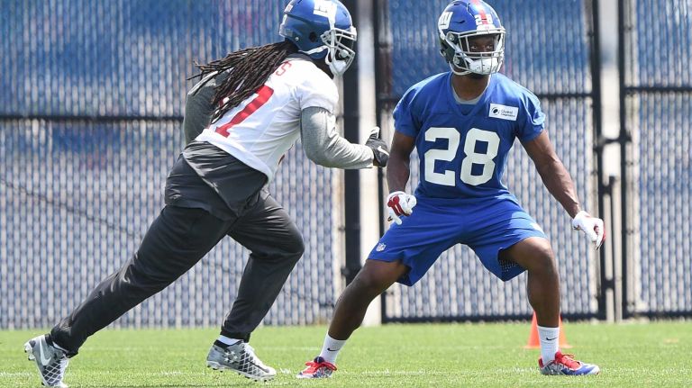 New York Giants cornerback Eli Apple, right, and wide receiver Dwayne Harris run a drill during the Giants Organized Team Activities at Quest Diagnostics Training Center on Wednesday, June 1, 2016.