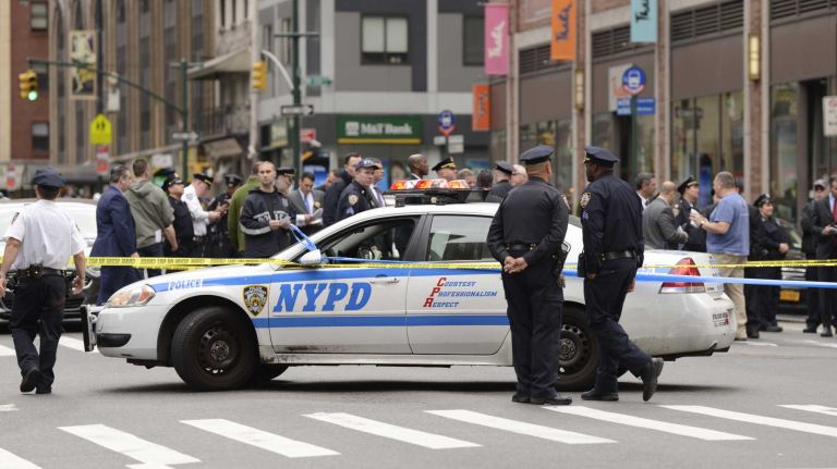NYPD officers were on the scene of a cop-involved shooting on May 18, 2016. Police said that a knife-wielding man was fatally wounded by police after a confrontation outside of a midtown Food Emporium.