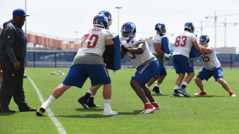 New York Giants center Weston Richburg and teammates participate in a drill during the Giants Organized Team Activities at Quest Diagnostics Training Center on Wednesday, June 1, 2016.