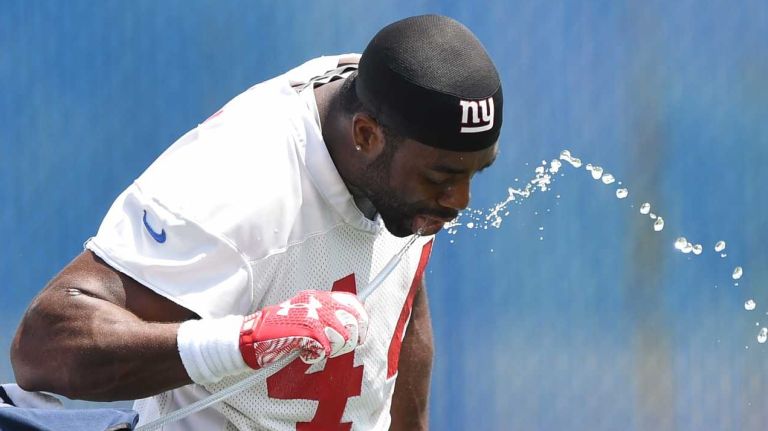 New York Giants running back Andre Williams hydrates during the Giants Organized Team Activities at Quest Diagnostics Training Center on Wednesday, June 1, 2016.