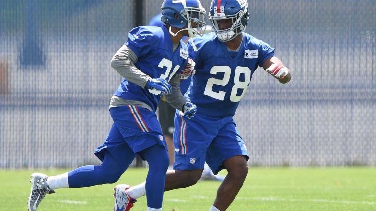 New York Giants cornerback Eli Apple, right, runs a drill with cornerback Trevin Wade during the Giants Organized Team Activities at Quest Diagnostics Training Center on Wednesday, June 1, 2016.