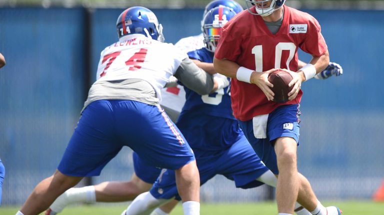New York Giants quarterback Eli Manning runs a drill during the Giants Organized Team Activities at Quest Diagnostics Training Center on Wednesday, June 1, 2016.