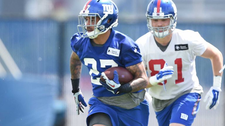 New York Giants safety Darian Thompson runs with the football during the Giants Organized Team Activities at Quest Diagnostics Training Center on Wednesday, June 1, 2016.