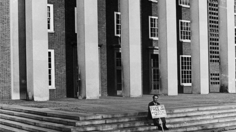 Professor Edward J. De Roo, of Jamaica, Queens, sits on the steps of Queens Borough Hall in Kew Gardens on Nov. 8, 1970. De Roo, a drama teacher at Nassau Community College, was at the forefront of an unsuccessful movement to have the borough of Queens secede from New York City.