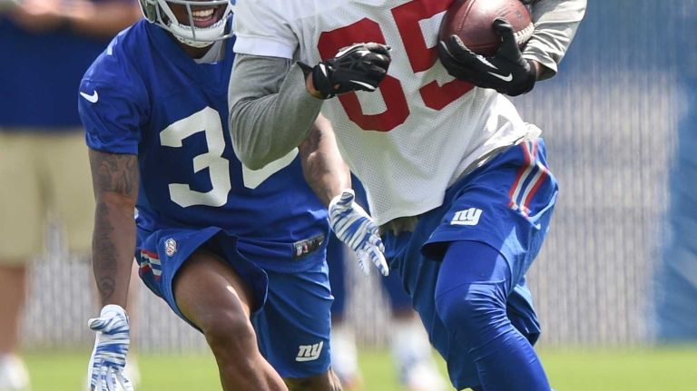 New York Giants wide receiver Donte Foster runs with the football during the Giants Organized Team Activities at Quest Diagnostics Training Center on Wednesday, June 1, 2016.