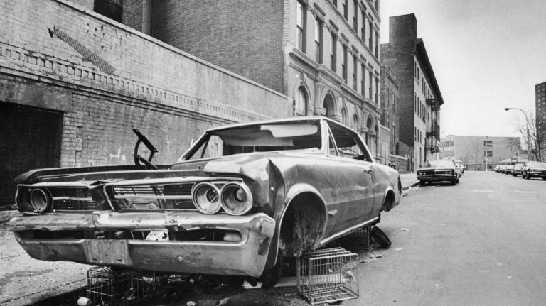 An abandoned car sits on East 146th Street in the South Bronx on March 31, 1972.