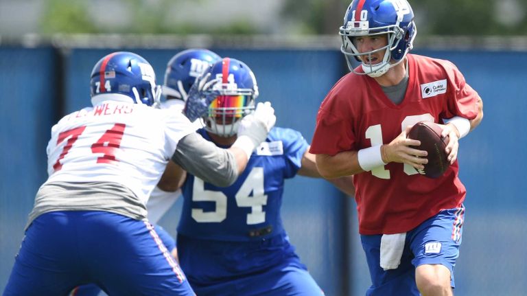 New York Giants quarterback Eli Manning runs a drill during the Giants Organized Team Activities at Quest Diagnostics Training Center on Wednesday, June 1, 2016.