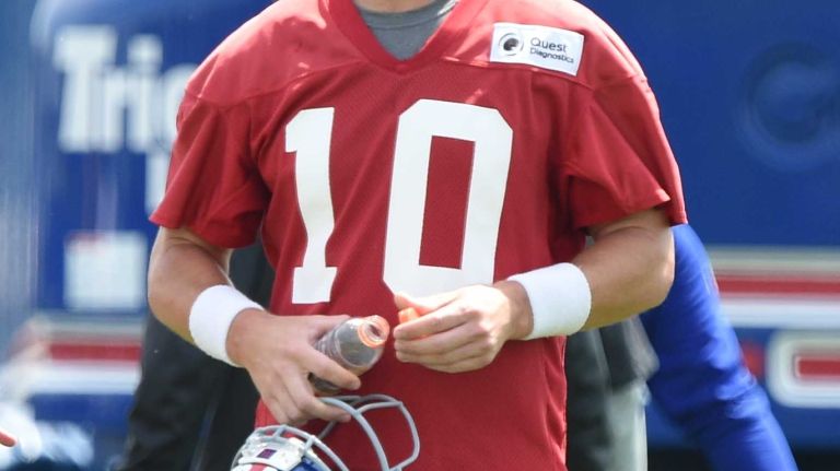 New York Giants quarterback Eli Manning looks on during the Giants Organized Team Activities at Quest Diagnostics Training Center on Wednesday, June 1, 2016.
