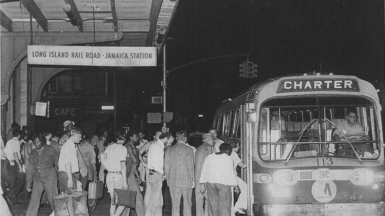 Long Island Rail Road passengers get on buses at the Jamaica station to go to Brooklyn and Manhattan during the blackout on July 13, 1977.