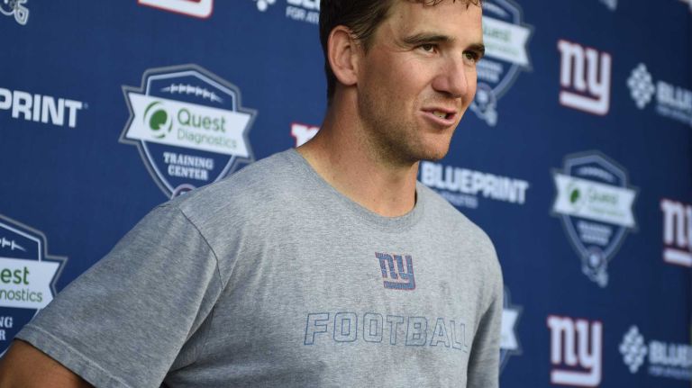 New York Giants quarterback Eli Manning answers questions from the media during the Giants Organized Team Activities at Quest Diagnostics Training Center on Monday, May 23, 2016.