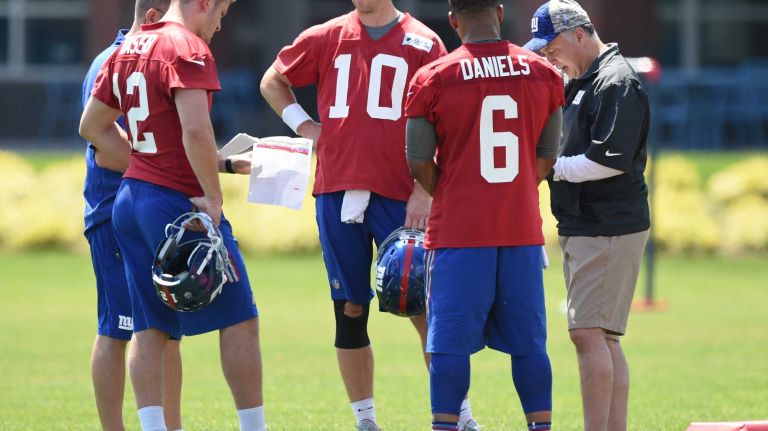 New York Giants quarterback Eli Manning stands with quarterback Ryan Nassib, left, and B.J Daniels during the Giants Organized Team Activities at Quest Diagnostics Training Center on Monday, May 23, 2016.