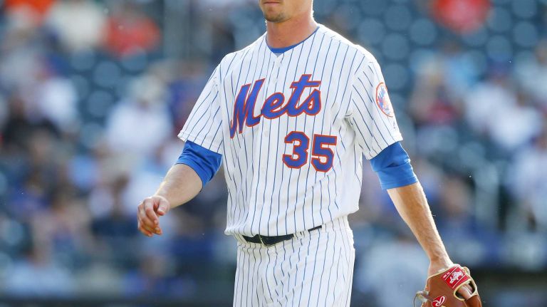 Logan Verrett #35 of the New York Mets walks to the dugout after the thirteenth inning against the Chicago White Sox at Citi Field on Wednesday, June 1, 2016 in the Queens Borough of New York City.