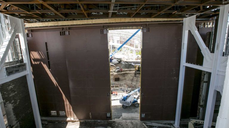 The stage faces west onto the beach in the summer. During the off-season, sliding stainless steel doors close and performances can take place inside. 