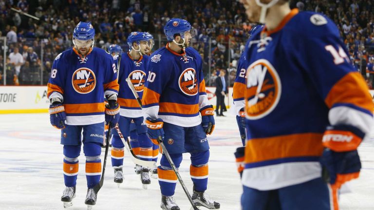 New York Islanders defenseman Marek Zidlicky (28) and New York Islanders center Alan Quine (10) walk off the ice dejected after the loss in overtime in Game 3 of the Eastern Conference semifinals against the Tampa Bay Lightning on Tuesday, May 3, 2016 at Barclays Center.