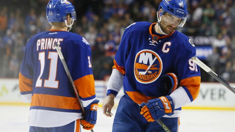 New York Islanders center Shane Prince (11) and New York Islanders center John Tavares (91) walk off dejected after the loss in overtime in Game 3 of the Eastern Conference semifinals against the Tampa Bay Lightning on Tuesday, May 3, 2016 at Barclays Center.
