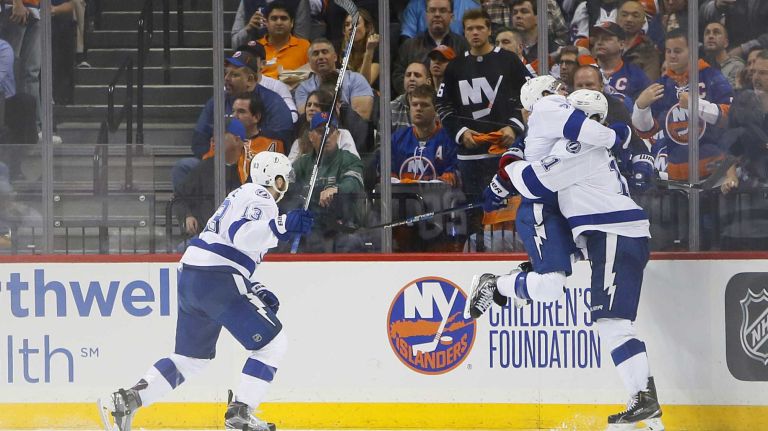Tampa Bay Lightning right wing Ryan Callahan (24) jumps into the arms of teammate Tampa Bay Lightning center Brian Boyle (11) after the winning goal in overtime in Game 3 of the Eastern Conference semifinals against the New York Islanders on Tuesday, May 3, 2016 at Barclays Center.