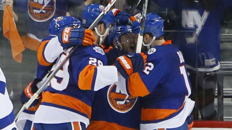 New York Islanders left wing Josh Bailey (12) celebrates the go-ahead goal with teammates in the third period in Game 3 of the Eastern Conference semifinals against the Tampa Bay Lightning on Tuesday, May 3, 2016 at Barclays Center.