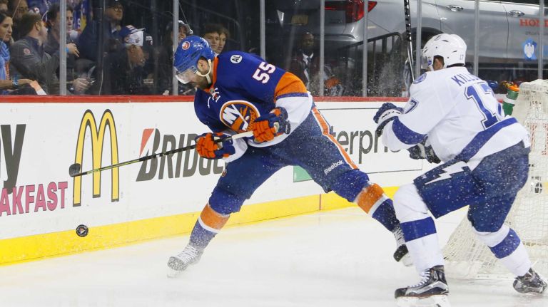 New York Islanders defenseman Johnny Boychuk (55) grabs the loose puck as he is defended by Tampa Bay Lightning center Alex Killorn (17) in the third period in Game 3 of the Eastern Conference semifinals on Tuesday, May 3, 2016 at Barclays Center.