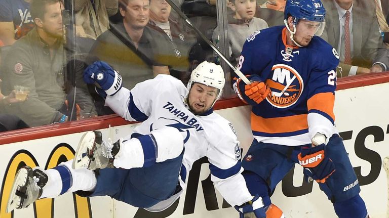 Tampa Bay Lightning center Tyler Johnson (9) is airborne after being hit by New York Islanders center Brock Nelson (29) in the second period in Game 3 of the Eastern Conference semifinals on Tuesday, May 3, 2016 at Barclays Center.