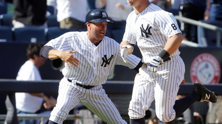 Yankees vs. Rays 81 Brett Gardner #11 of the New York Yankees reacts after his ninth inning game winning home run against the Tampa Bay Rays with third base coach Joe Espada #53 at Yankee Stadium on Saturday, April 23, 2016 in the Bronx Borough of New York City.