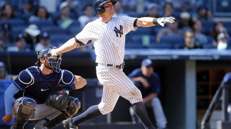 Yankees vs. Rays 86 Brett Gardner #11 of the New York Yankees follows through on his ninth inning game winning home run against the Tampa Bay Rays at Yankee Stadium on Saturday, April 23, 2016 in the Bronx Borough of New York City.