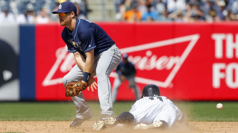 Yankees vs. Rays 93 Brett Gardner #11 of the New York Yankees steals second base in the sixth inning as Logan Forsythe #11 of the Tampa Bay Rays can't come up with the ball at Yankee Stadium on Saturday, April 23, 2016 in the Bronx Borough of New York City.