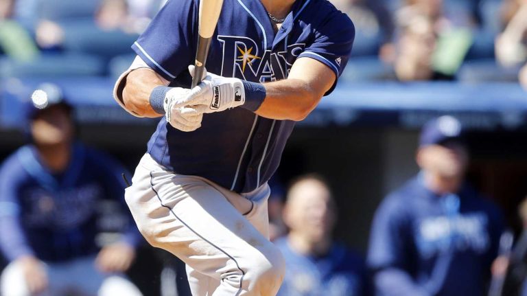 Yankees vs. Rays 96 Kevin Kiermaier #39 of the Tampa Bay Rays follows through on a fifth inning home run against the New York Yankees at Yankee Stadium on Saturday, April 23, 2016 in the Bronx Borough of New York City.