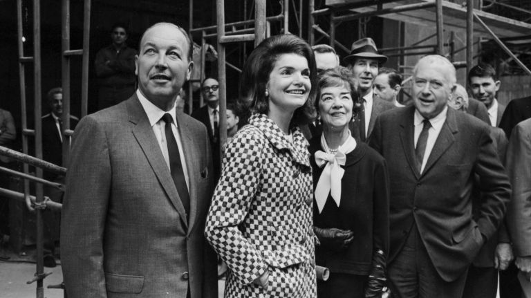 John Baur, left, associate director of the Whitney Museum of American Art, former first lady Jacqueline Kennedy, center, Flora Whitney Miller, president of the museum, and architect Marcel Breuer Tour, admire the final stage of the building's construction on Oct. 21, 1965.