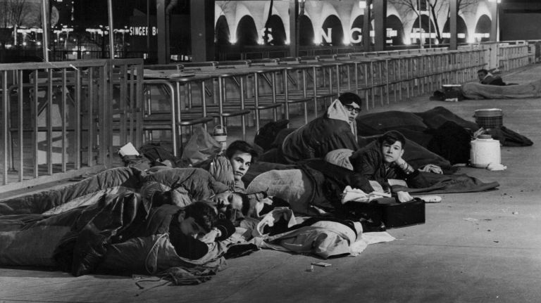 Teens camp out near the entrance to the New York World's Fair on April 20, 1965, hoping to be among the first through the gates when the fair opens for the season. Gary Schuster, 17, of New Jersey, waited two days at the head of the line, but was beat out as first to enter by Leonard Landeman, 16, of Plainview, when multiple turnstiles were opened at once.