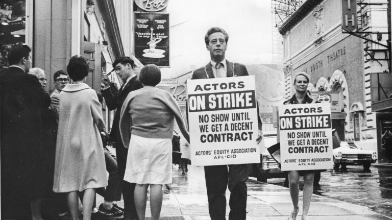 An Actors' Equity Association strike ruined the plans of some high school seniors from Vermont, at left, who had travelled to Manhattan to see a play. Two picketing actors are seen on June 17, 1968, during the three-night strike which closed 19 Broadway shows and affected 700 performers.