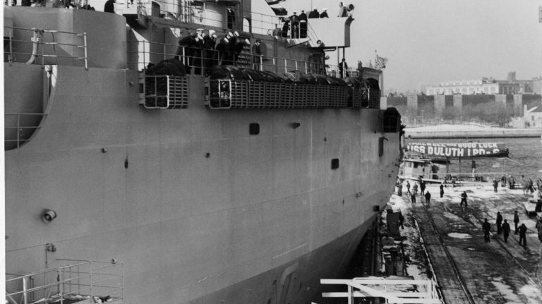 The USS Duluth, the last ship constructed at the New York Naval Shipyard in Brooklyn, hits the dock as she is pulled by a tugboat on Feb. 1, 1966. The ship sustained a small gash above the water line. The shipyard was closed at the end of June 1966 as a governmental cost-saving effort after 146 years in service.