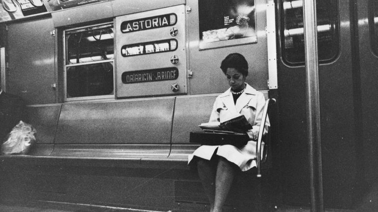 A woman rides the subway at night on the Brighton Beach line in Brooklyn on June 1, 1964.