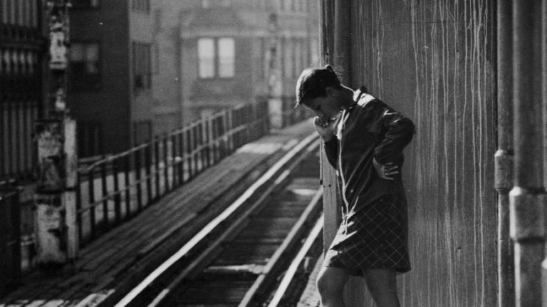 A woman waits on an elevated train platform on the Myrtle Avenue line in Brooklyn on Sept. 30, 1969. Days later, service was discontinued on the elevated portion of the line, which spanned 35 blocks from Jay Street in downtown Brooklyn to Broadway in Williamsburg. The Myrtle Avenue el featured New York City's last wooden subway cars. 