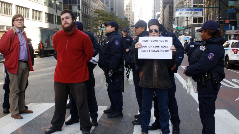 A protest against yearly hikes on rent-controlled apartments outside Gov. Andrew Cuomo's office at 633 Third Ave. in Manhattan resulted in arrests after tenants and housing advocates disrupted traffic on Monday, Nov. 27, 2017.