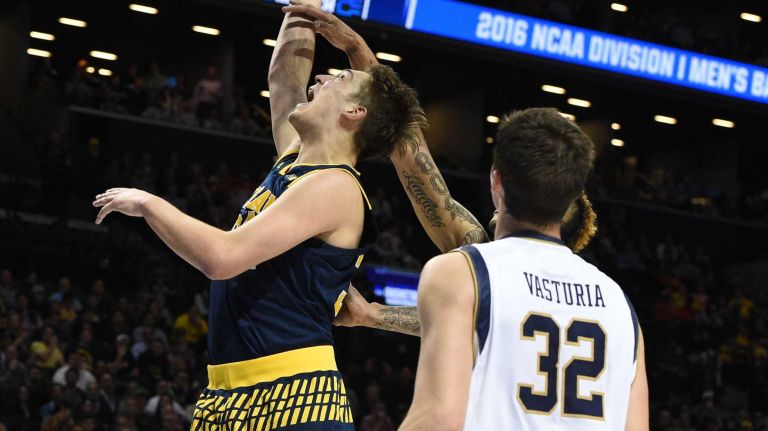 NCAA Tournament: Notre Dame vs. Michigan 26 Michigan Wolverines forward Mark Donnal puts up a shot against the Notre Dame Fighting Irish during the first round of an East Regional men's basketball game in the NCAA Tournament at Barclays Center on Friday, March 18, 2016.