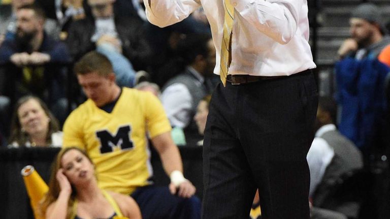 NCAA Tournament: Notre Dame vs. Michigan 28 Michigan Wolverines head coach John Beilein reacts against the Notre Dame Fighting Irish during the first round of an East Regional men's basketball game in the NCAA Tournament at Barclays Center on Friday, March 18, 2016.
