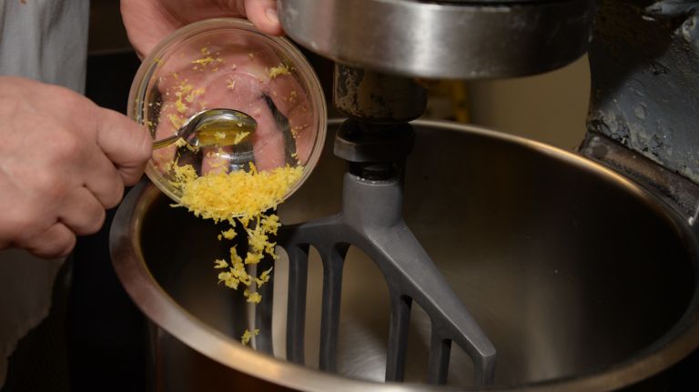 Zest 1 lemon and add into the mixing bowl as the sweet dough continues to form. 