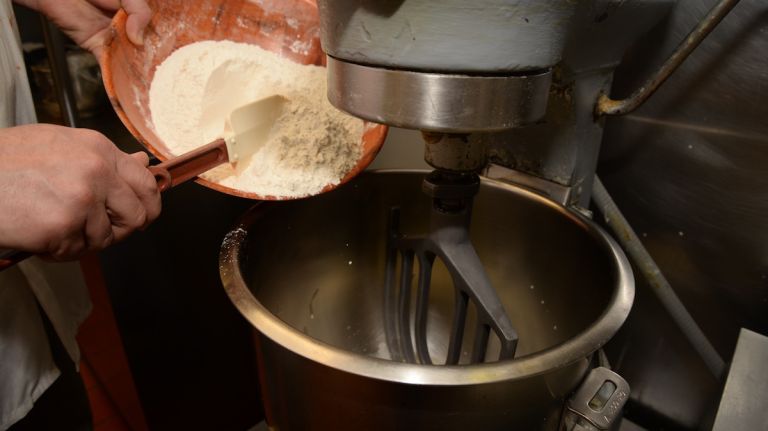 Add 3 1/2 cups of flour to the bowl and allow to mix on low speed until combined and thick. 