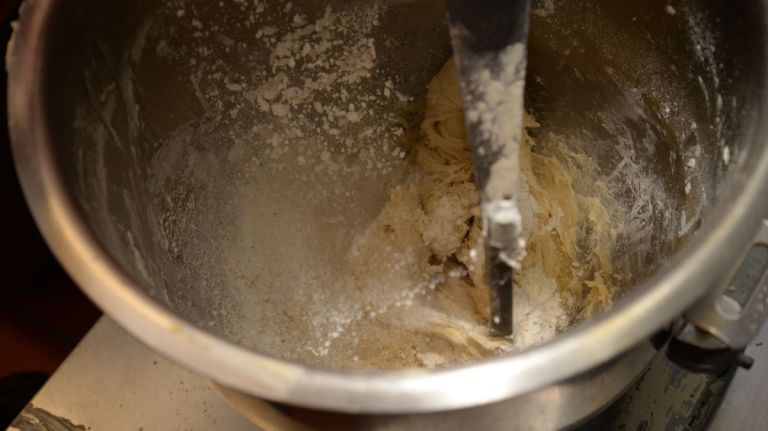 The tricky thing with bread, Scognamillo explained, is that it can easily be messed up. How? By adding too much flour! When adding the remaining 1 1/2 cups of flour, add a little at a time to the mixer until the dough is soft and leaves the bowl clean with nothing sticking to its sides. This happens quickly. You may not use all of the flour. 